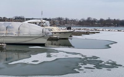 Boat docked on a frozen lake