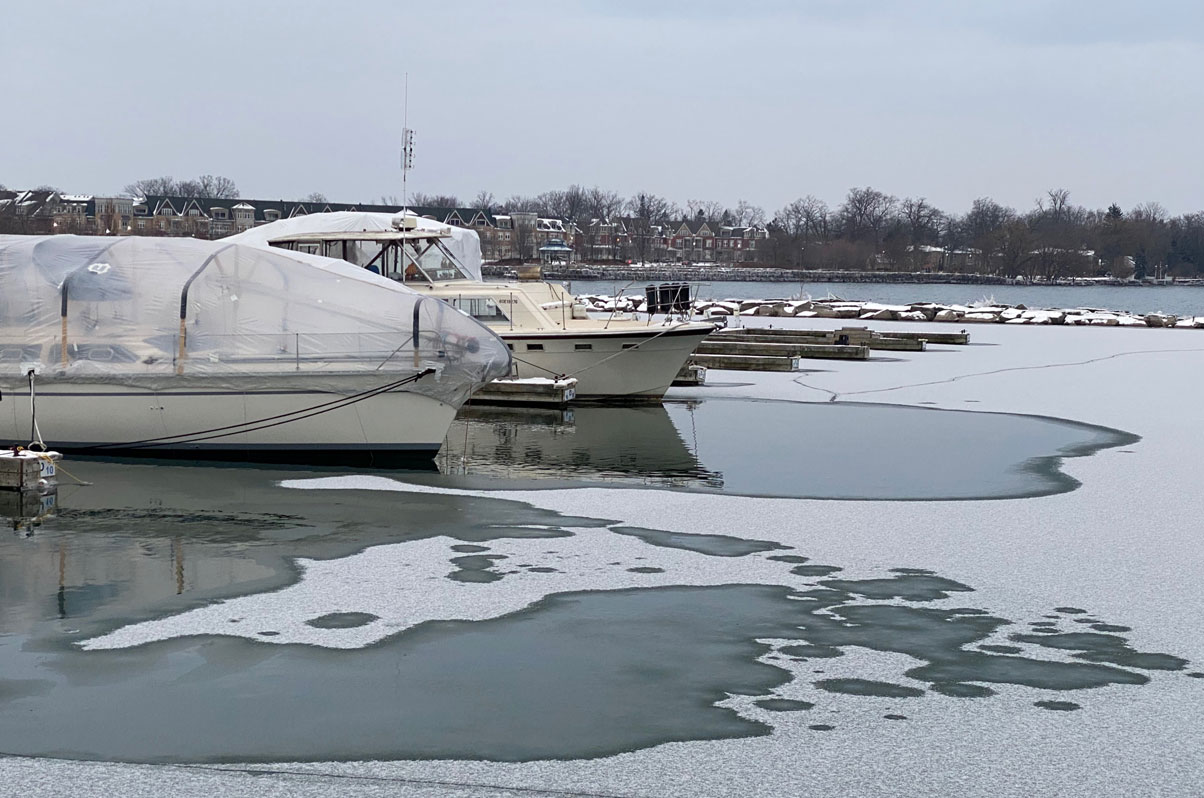 Boat docked on a frozen lake