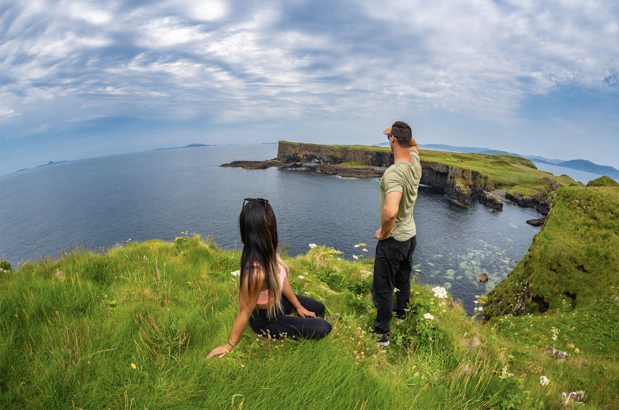 Sailing Jibsea exploring and discovering Scotland - standing over cliff watching the view of the coast line